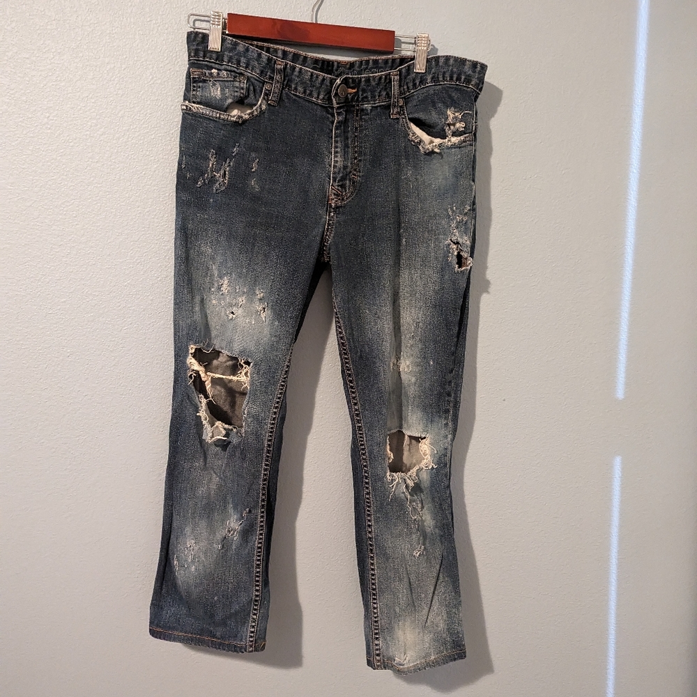 Super distressed slim straight jeans